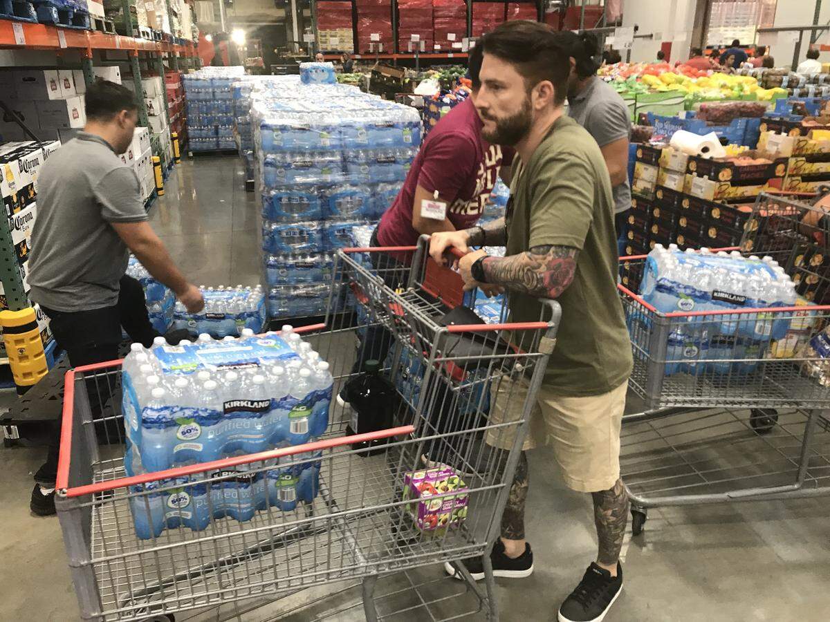 Customers stock up on bottled water at Costco, located at 77th street West Flagler, as Miami-Dade County prepares on Thursday, August 29, 2019 for the possible impact of Hurricane Dorian.