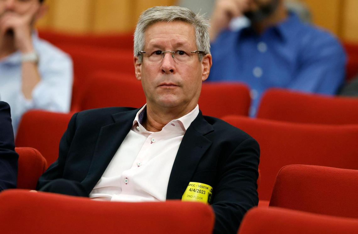 Eric Woolworth, president of business operations with The HEAT Group, listens to commissioners speak before the renaming of Miami-Dade Arena as the Kaseya Center after a Miami-based software firm at the Miami-Dade commission chambers in Miami on Tuesday, April 4, 2023.