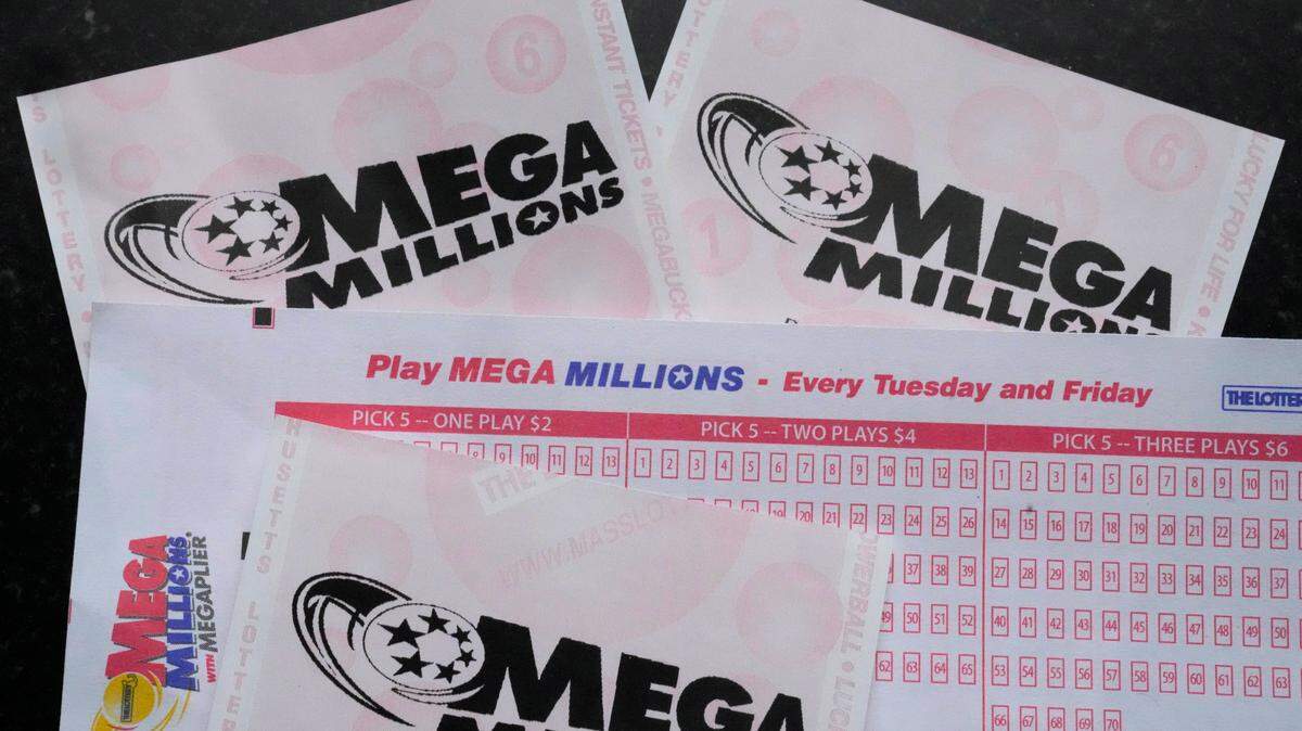 Mega Millions lottery tickets and a wager slip are displayed, Friday, Jan. 6, 2023, in Derry, N.H. No one has won the jackpot since Oct. 14, 2022, lottery officials said.
