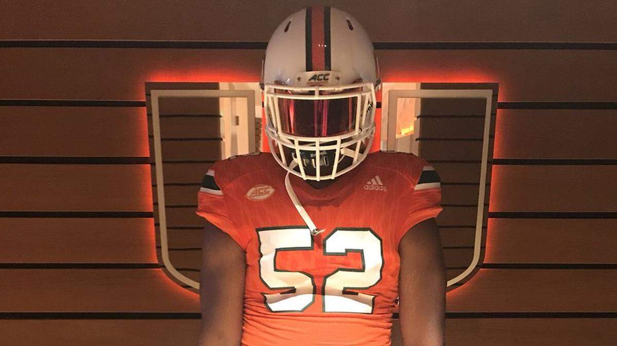 Jason Blissett poses for a photo in a Miami jersey shortly before receiving his Hurricanes offer in July.