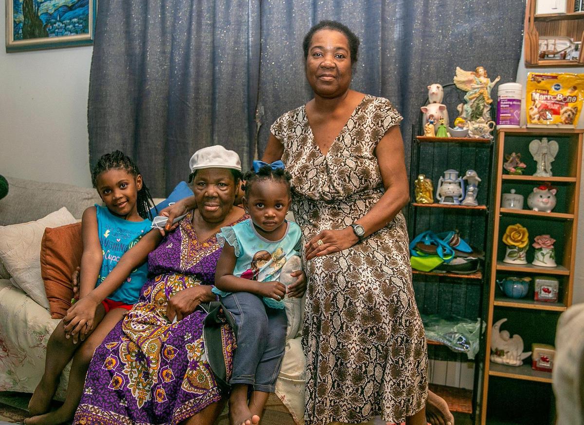 Hortense Mitchell, far right, with her mother, Viola Richards, and granddaughters Le’Shay, 5, far left, and Elaine, 2, at their house in Florida City.