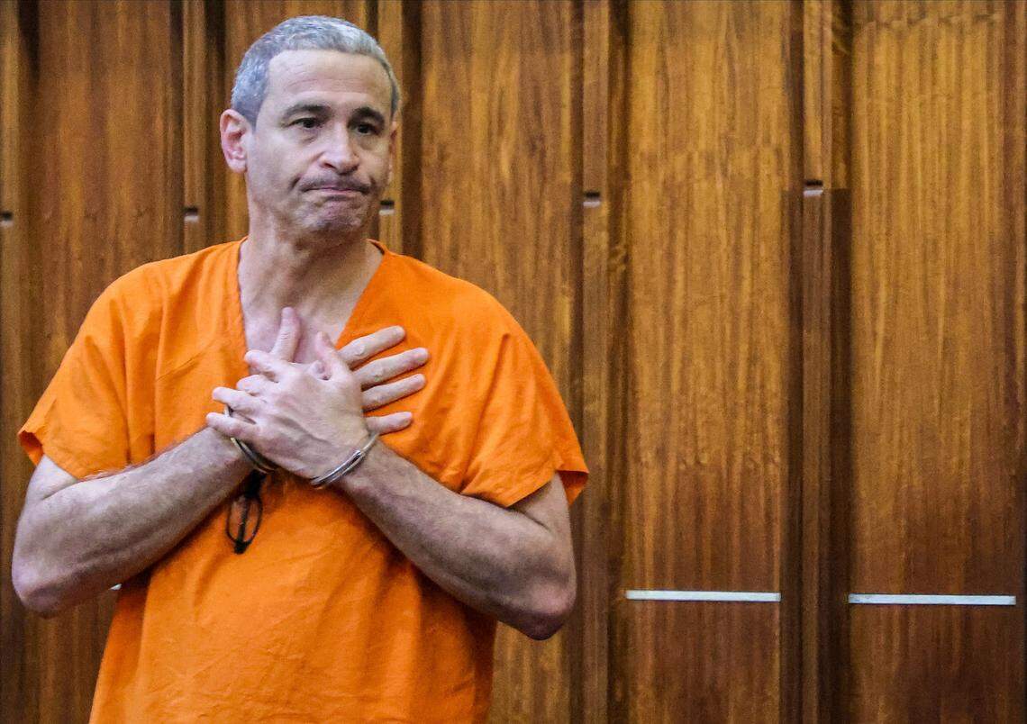 Osmel Lugo-Gutierrez gestures to his wife, daughter, and supporter after being sentenced after being convicted of manslaughter for killing Franklyn Pineyro inside a Coral Gables Publix inside Courtroom 2-8 at Richard E. Gerstein Justice Building on Wednesday, January 14, 2026, in Miami, Florida.