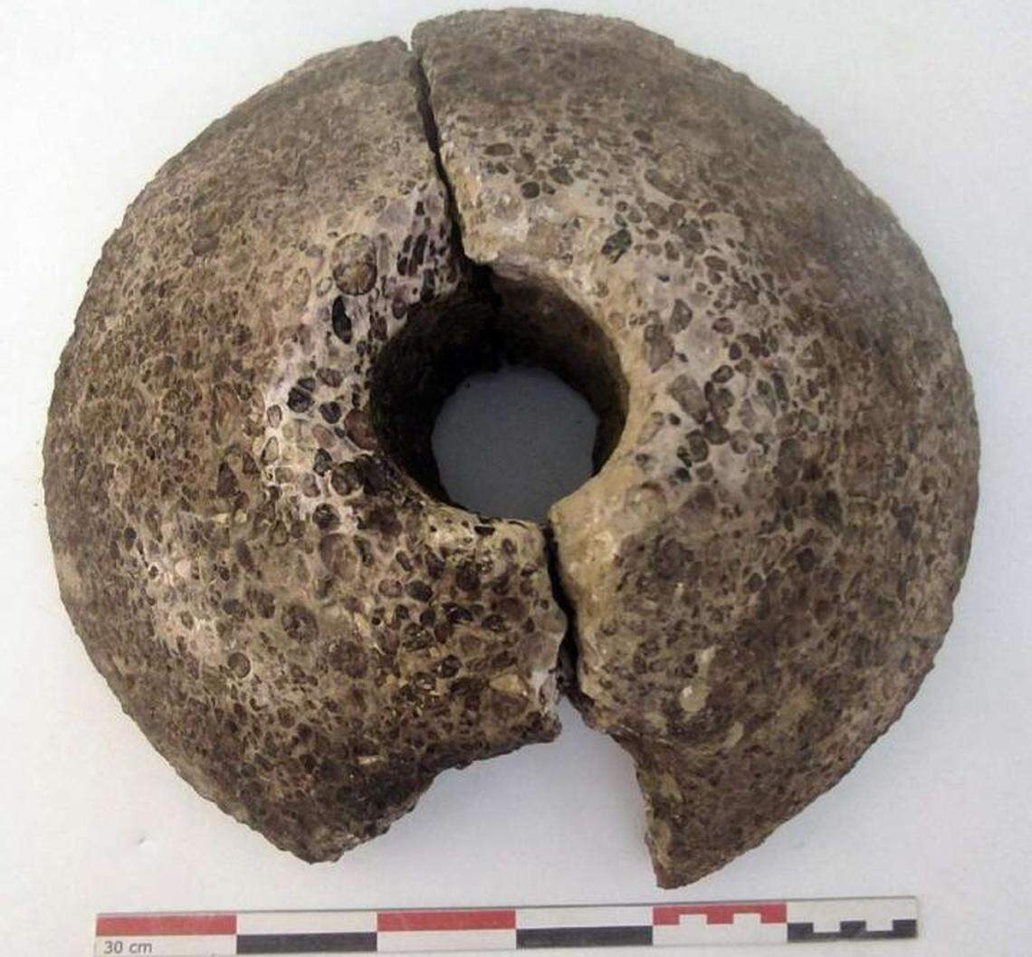 A grindstone was unearthed from the bottom of the cellar.