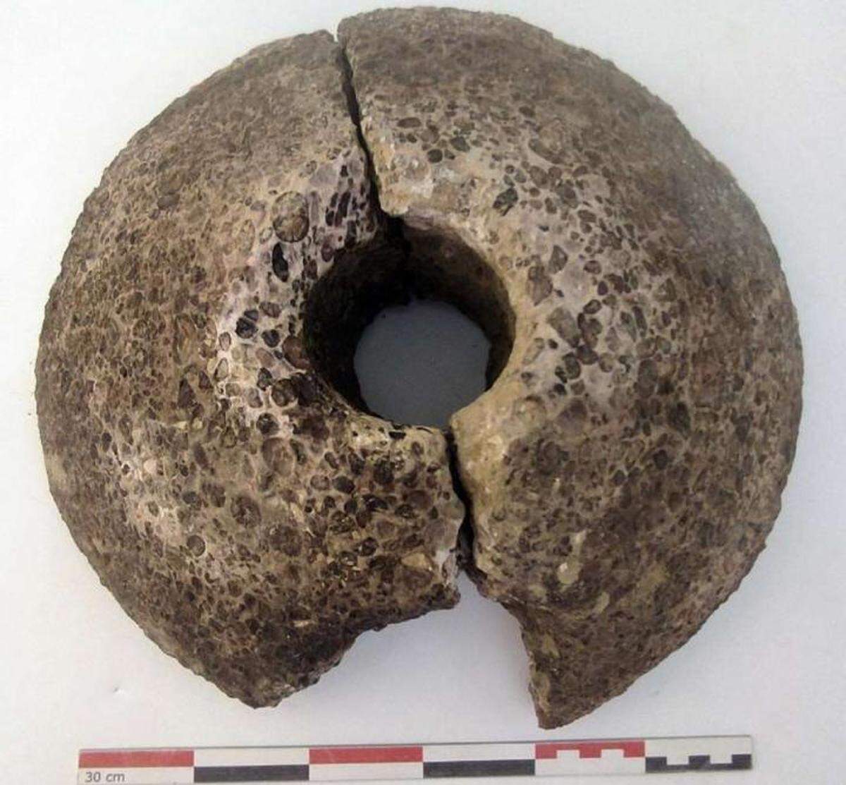 A grindstone was unearthed from the bottom of the cellar.