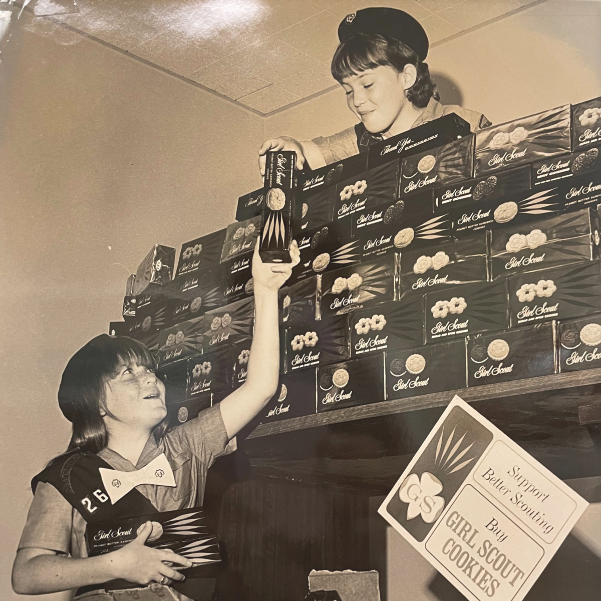 Girl Scouts set up their troop’s cookie booth in the 1960s. The Girl Scouts of Tropical Florida is asking for photos, artifacts of any kind, and personal stories to mark its 100 year anniversary.