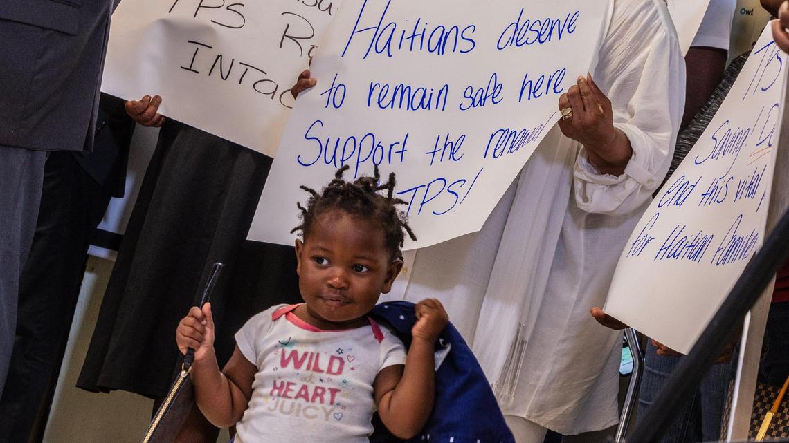 Jenny Bellus, 22 months old, attends a press conference with her mother Rose Myrlene Elmond, a TPS holder, called by the Family Action Network Movement to discuss the roll back of Haiti TPS by the Trump administration on Feb. 21, 2025.