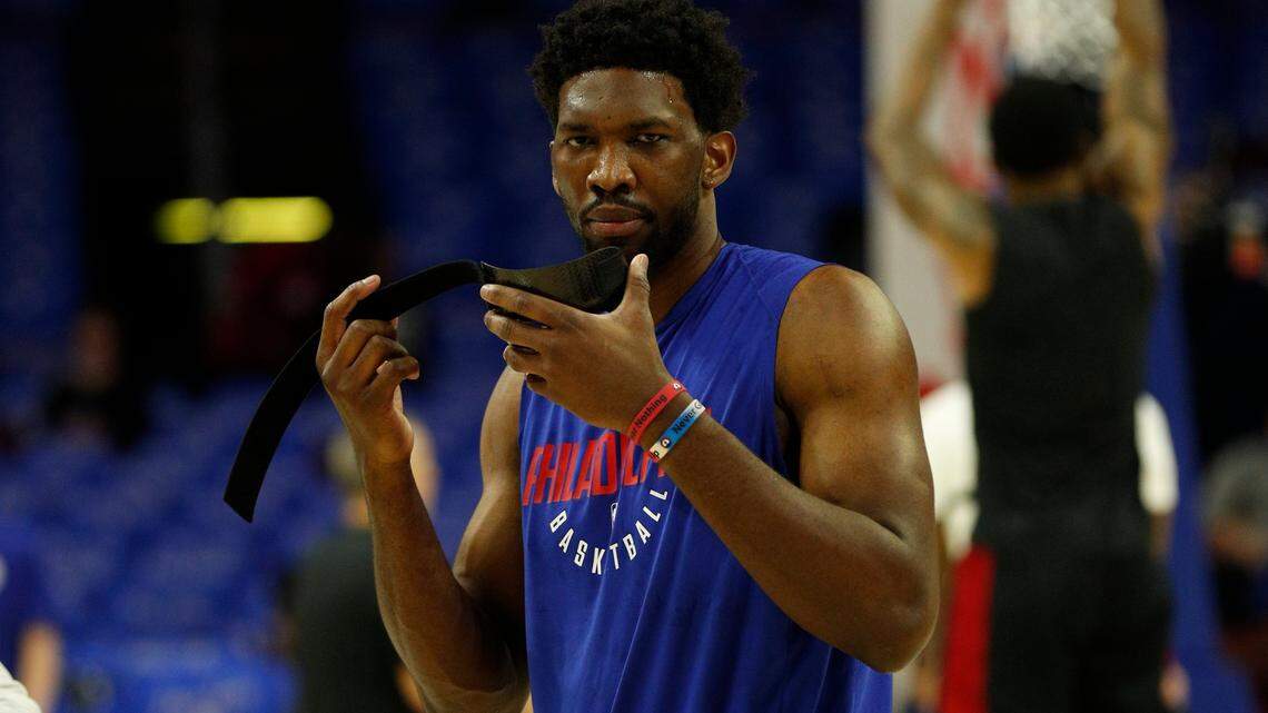 Philadelphia 76ers' Joel Embiid, of Cameroon, about to put his mask back on prior to the first half in Game 1 of a first-round NBA basketball playoff series against the Miami Heat, Sat., April 14, 2018, in Philadelphia.