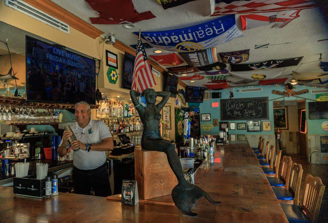 Bartender Alain de la Rosa, mixes a drink in the bar at the iconic Catch of the Day Restaurant on Lejeune Avenue in Miami, on Tuesday October, 14 2025.