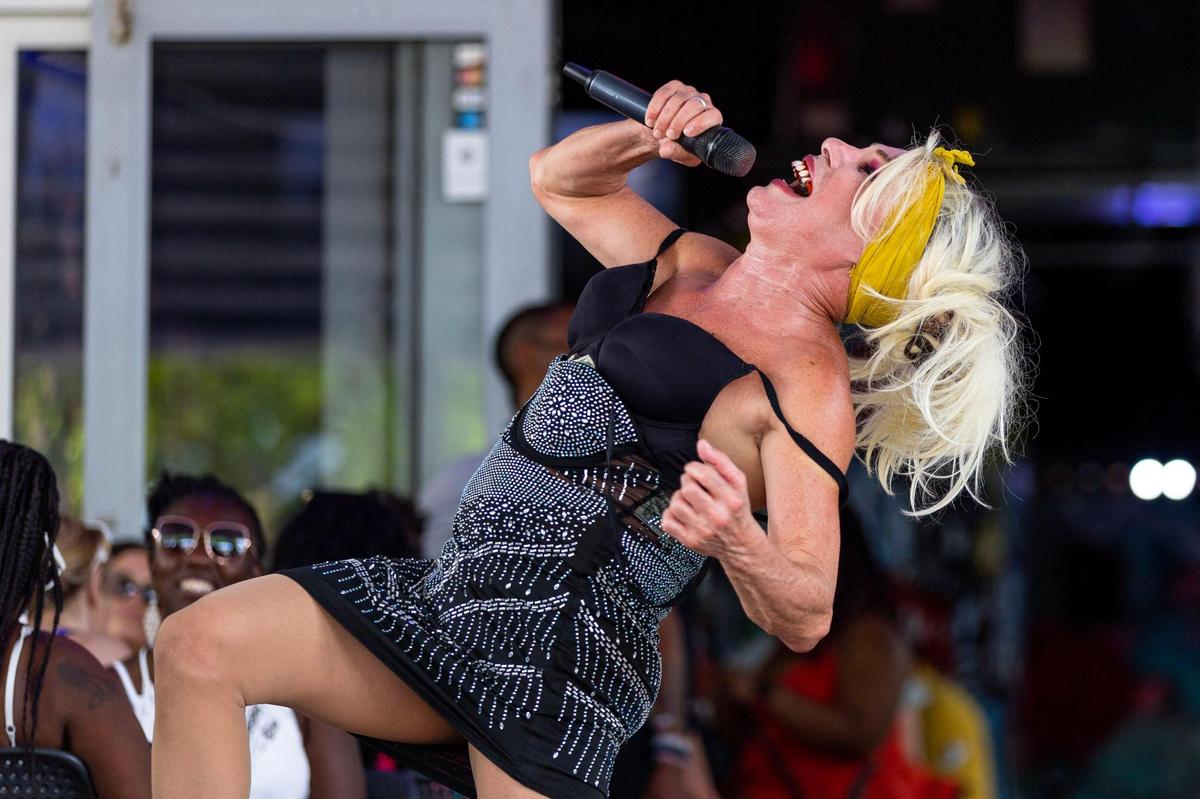 Performer ‘Josefina, la mujer de los globos’ interacts with guests at Palace Bar & Restaurant off Ocean Drive during Memorial Day weekend at Miami Beach, Florida, on Monday, May 29, 2023.