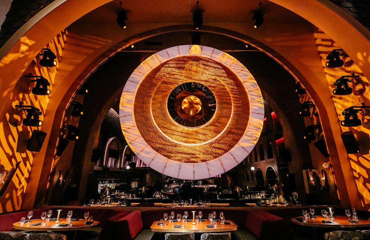 The luxurious dining room at the restaurant Queen in Miami Beach in the historic Paris Theater.