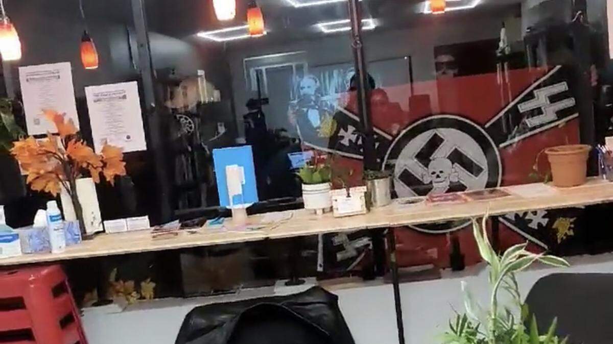 Neo-Nazis with a swastika flag interrupted a community library celebration reading of the Communist Manifesto in Providence, Rhode Island, police said. 