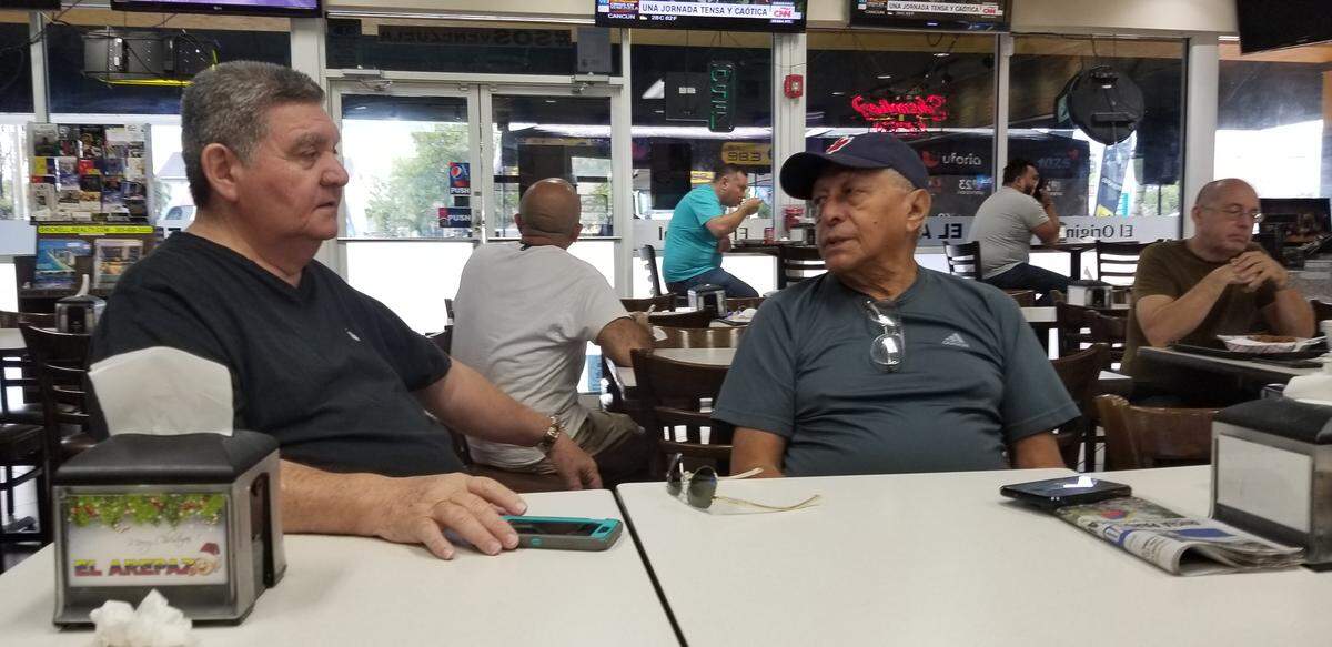 Raul Lopez, 70, and Jesus Aranguren, 81, are Venezuelans who came to El Arepazo Original restaurant in Doral on Wednesday morning, May 1, 2019.