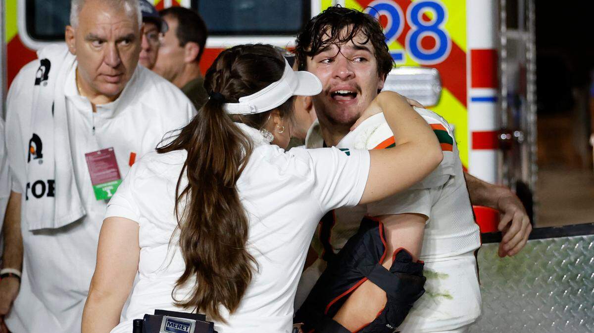 An injured Miami Hurricanes quarterback Emory Williams (17) is attended to by medical staff late in the fourth quarter during the game against the Florida State Seminoles during the fourth quarter at Doak Campbell Stadium in Tallahassee on Saturday, November 11, 2023.