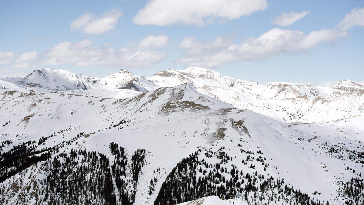 Snow covered peaks lining the Continental Divide are seen from the Lenawee chairlift at Arapahoe Basin in Summit County, Colorado, on April 2, 2023. Arapahoe Basin, located on the western side of the Continental Divide, has a base elevation of 10,780 ft (3,286 m). With exceptional snow falling west of the Divide, several ski resorts from Colorado to California are anticipating extending ski seasons into the summer months. The elevated levels of the snowpack have led to hydrologists and climatologists forecasting that many reservoirs in the west will begin to rebound and partially fill after years of drought. (Photo by Jason Connolly / AFP via Getty Images)