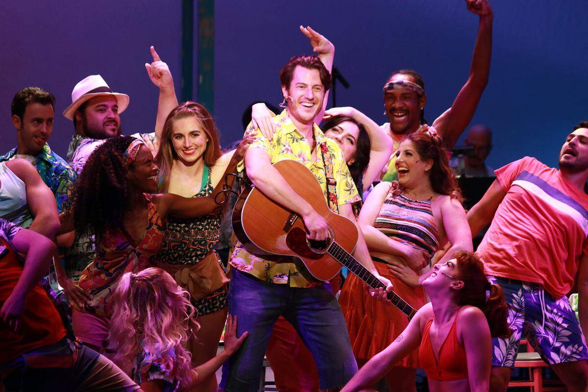 Sam Sherwood and the Ensemble in “Jimmy Buffett’s Escape to Margaritaville.” (Photo courtesy of Alberto Romeu)