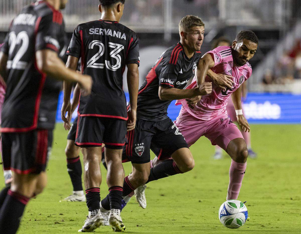 Inter Miami midfielder Yannick Bright (42) and D.C. United midfielder Jackson Hopkins (25) compete for the ball in the second half of their MLS match at Chase Stadium on Saturday, Sept. 20, 2025, in Fort Lauderdale, Fla.