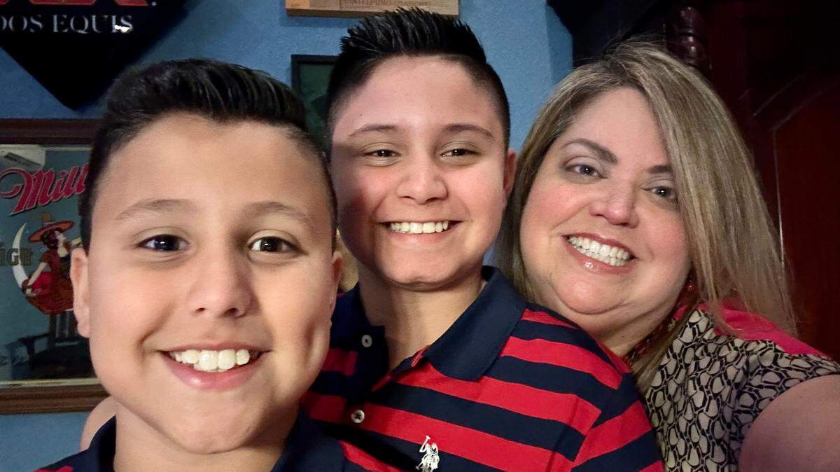 Mari Miranda with her two sons, Alexander, closest to her, and Andres. Working with Parent to Parent of Miami, she has gotten help with both of her sons’ school accommodations.