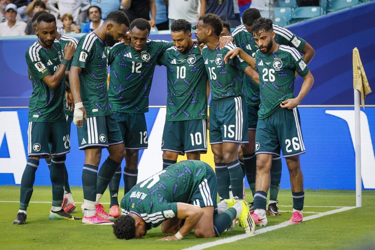 Saudi Arabia defender Abdulelah al-Amri (4) kisses the ground after scoring in the first half during the match against Saudi Arabia during the FIFA World Cup opening match at Miami Stadium on Monday, June 15, 2026.