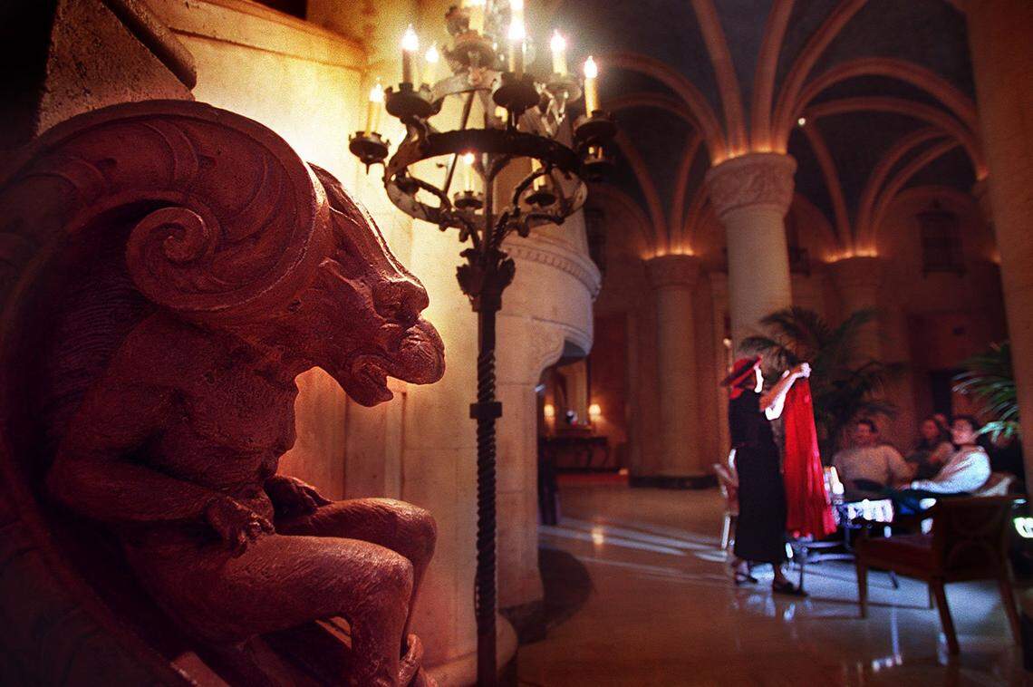 Storyteller Linda Spitzer tells tales of ghosts at the Biltmore as the resident gargoyle watches over the lobby of the historic Coral Gables hotel in 1999.