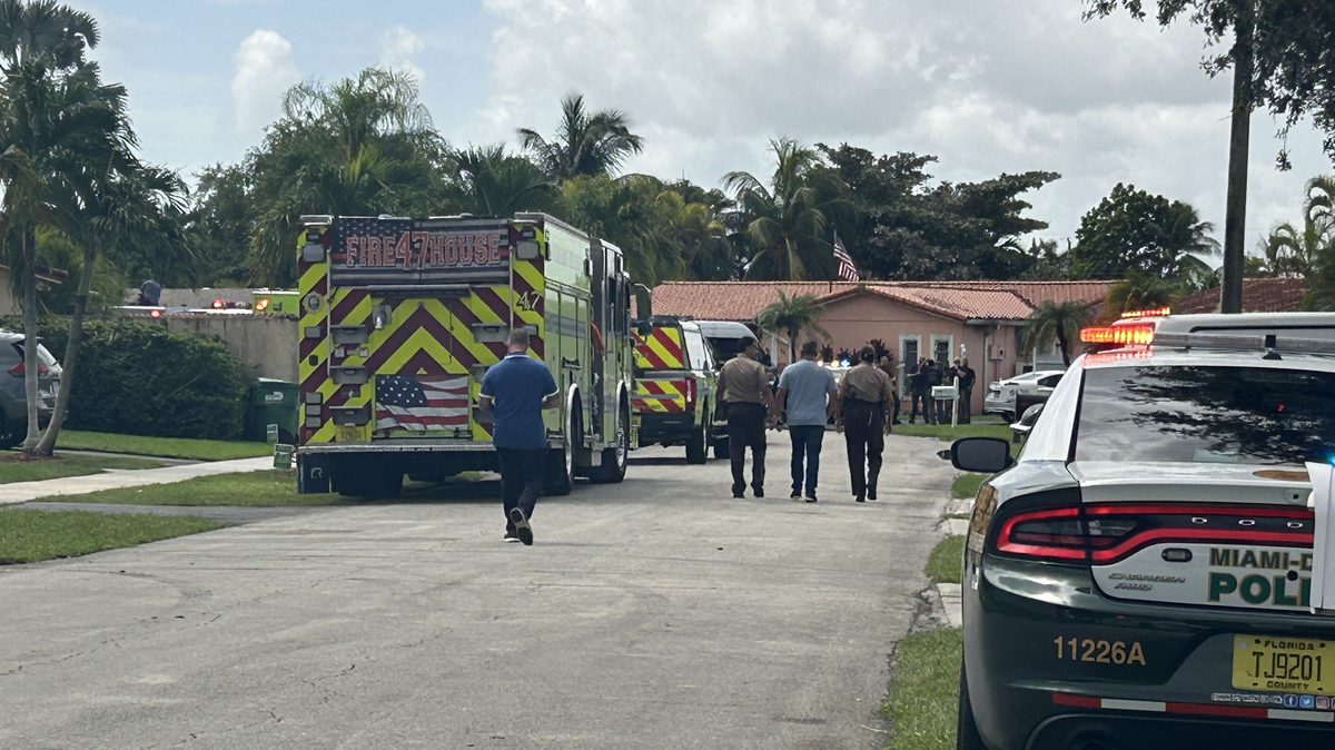 Multiple fire trucks and law enforcement patrol cars could be seen near the 10800 block of Southwest 67th Drive after a house fire broke out on Friday morning, Aug. 8, 2025.