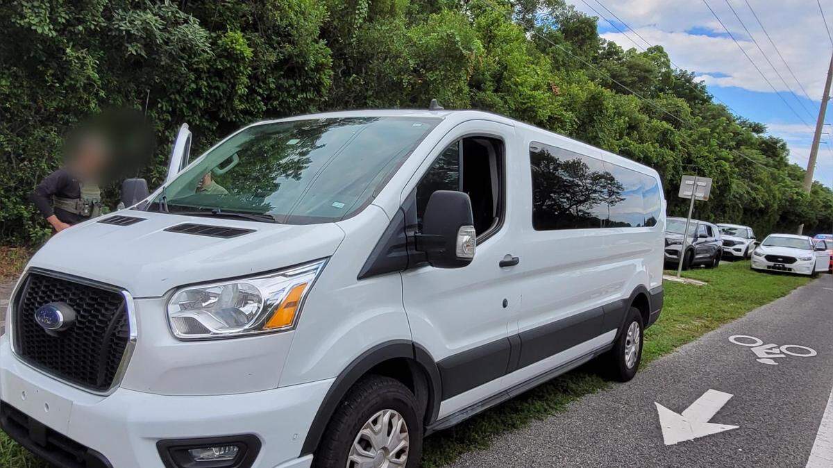 A white Ford van is parked on the side of U.S. 1 in Key Largo Thursday, Sept. 7, 2023. The Border Patrol and Monroe County Sheriff’s Office say it was carrying people from Cuba recently smuggled into the Florida Keys.