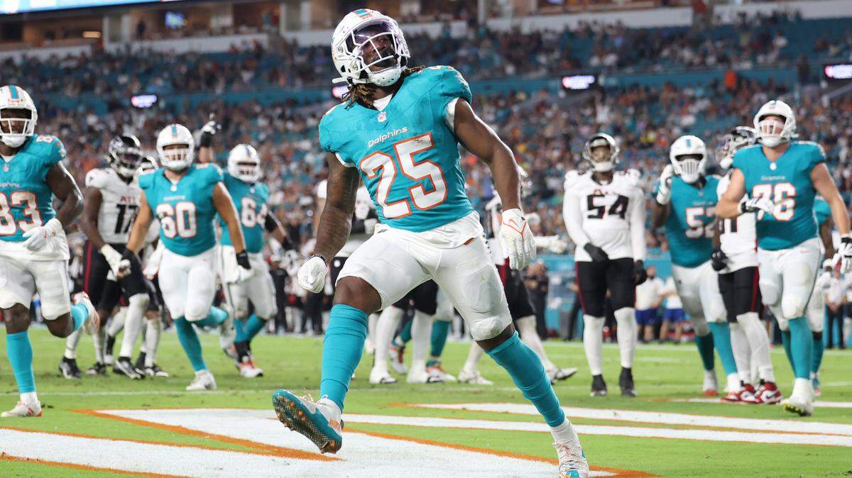 Miami Dolphins running back Jaylen Wright (25) reacts after scoring against the Atlanta Falcons in the second quarter at Hard Rock Stadium, in Miami Gardens, Florida on Friday, August 9, 2024.