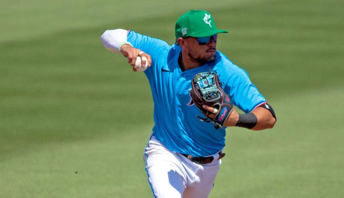 Miami Marlins shortstop Miguel Rojas (19) throws to first to put out New York Mets designated hitter Jeff McNeil (6) during the sixth inning of their spring training baseball game at Roger Dean Chevrolet Stadium on Wednesday, March 17, 2021 in Jupiter, Florida.