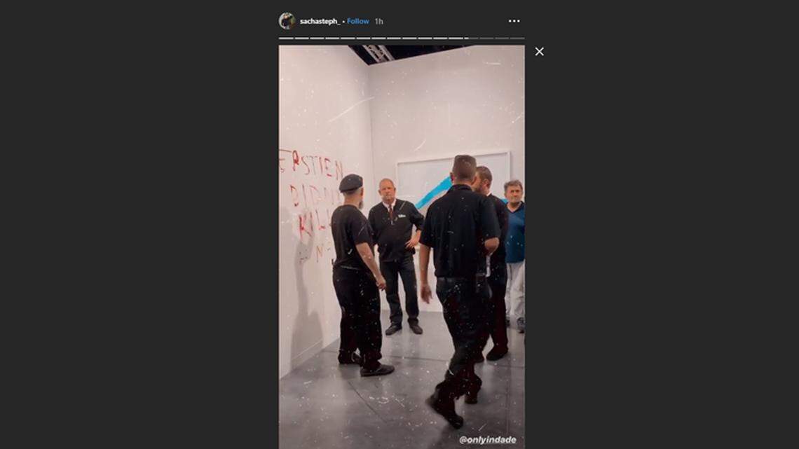 Banana wall vandalized with lipstick at Art Basel. The message was about Jeffrey Epstein