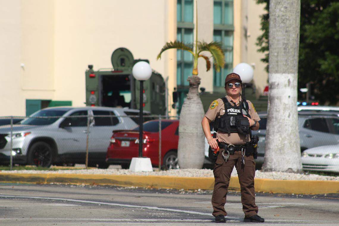 A Miami-Dade Sheriff’s Office deputy stands near International Park apartments, located near 2055 SW 122nd Ave, after a man barricaded himself in an apartment after allegedly slamming his 5-year-old son into a wall on June 7, 2025.