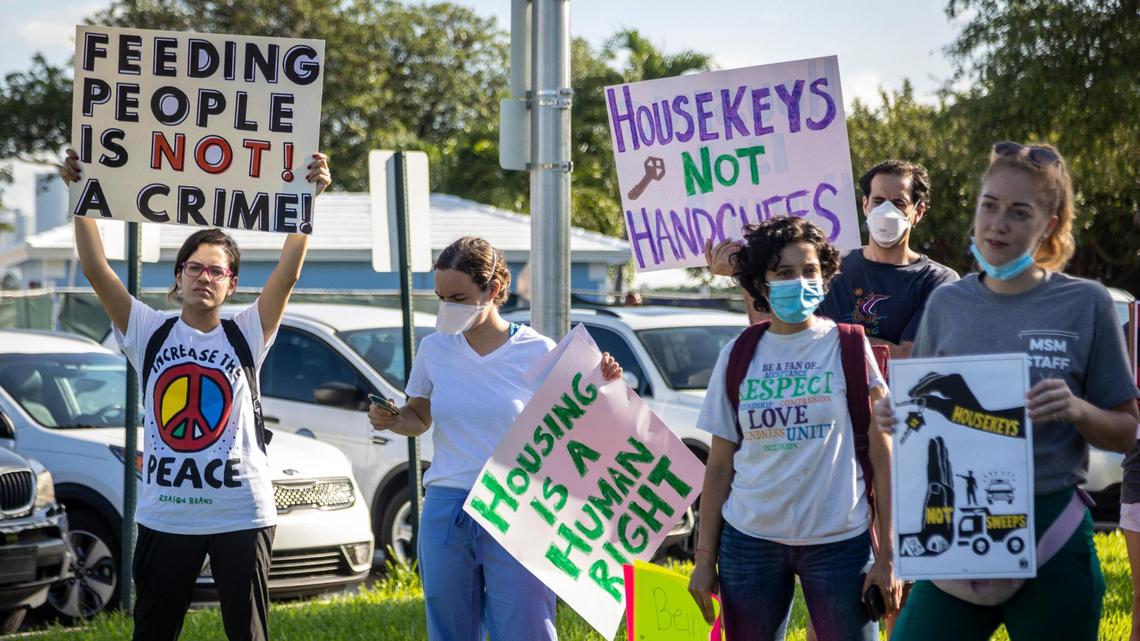 Activists protest in front of Miami City Hall earlier this month against Ordinance SR 2, which bans homeless encampments and says police can arrest violators.