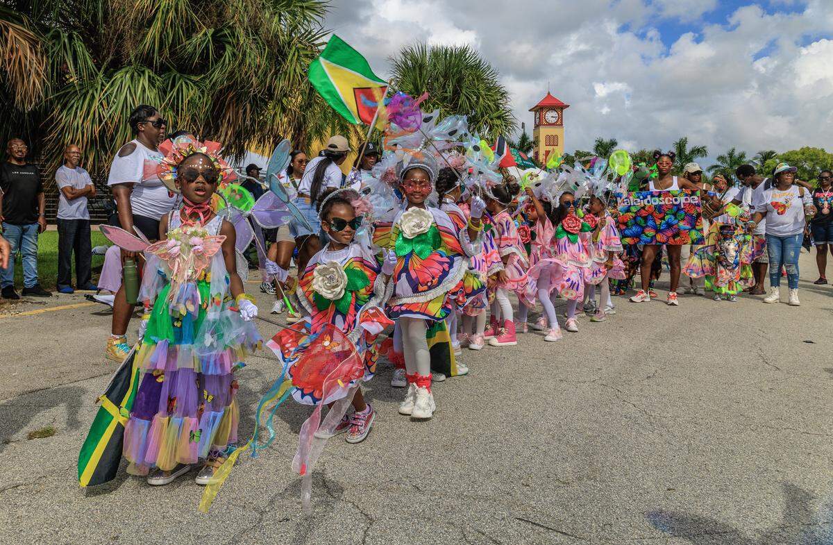 Performers with the Major Players band performed during the Junior Carnival's parade, that featured performances and costumed parades from seven junior masquerade bands, outside of the Lauderhill Performing Arts Center, in Broward, on Saturday October 04, 2025.
