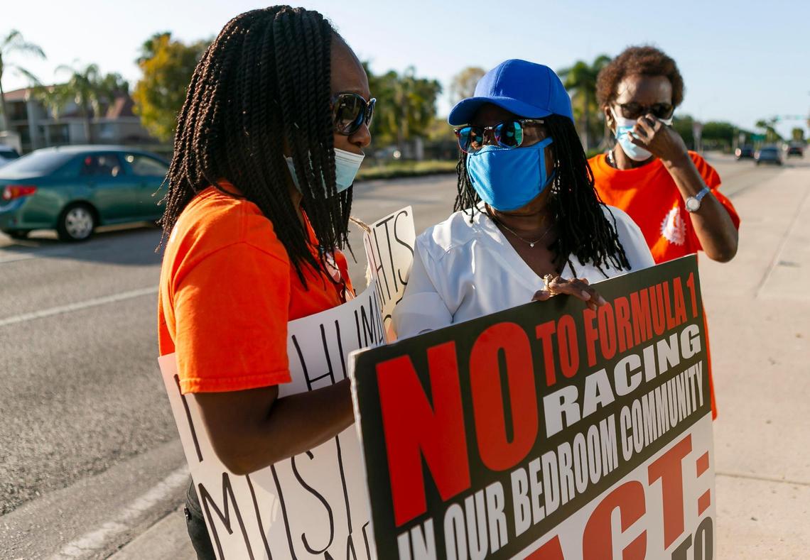 Lillie Bell, left, and Bettye Cepeda, center, participate in a protest near the Shirley M. Gibson City Hall in Miami Gardens, Florida, on Wednesday, April 14, 2021. Activists gathered in opposition of bringing Formula One Racing to Hard Rock Stadium in Miami Gardens.