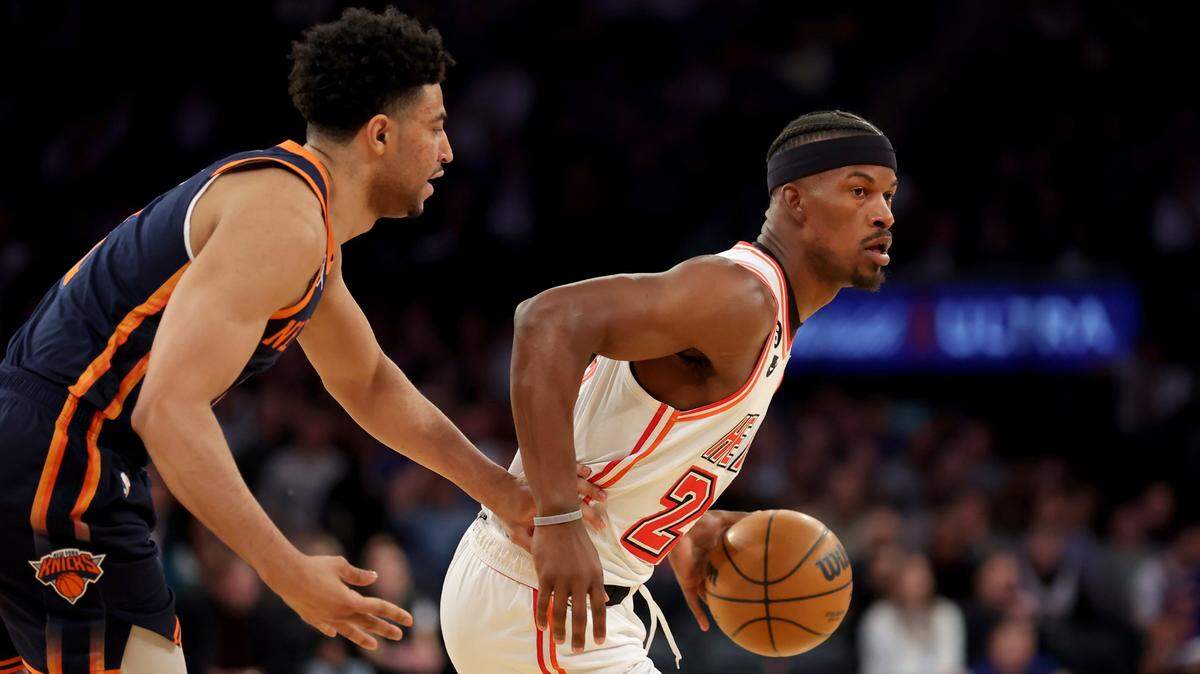 Miami Heat forward Jimmy Butler (22) drives around New York Knicks guard Quentin Grimes (6) during the first quarter at Madison Square Garden.