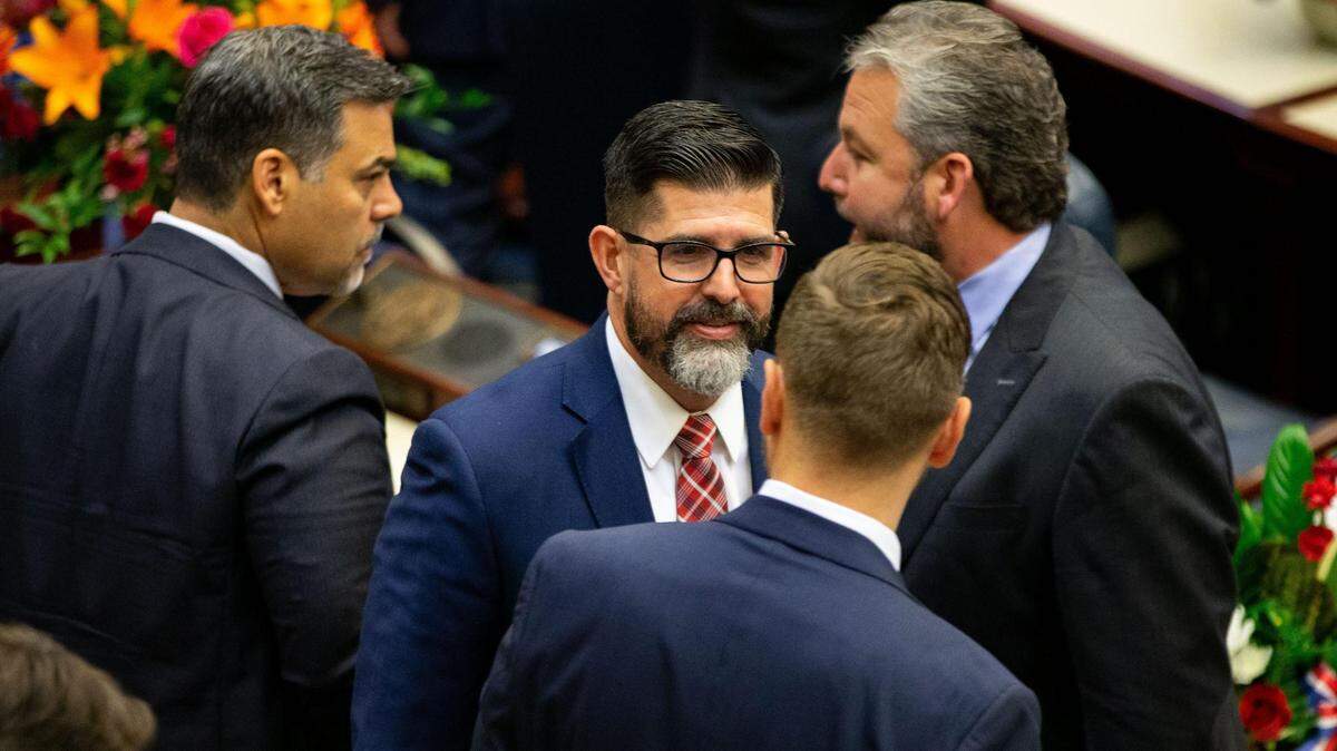 Education Commissioner Manny Diaz talks with his peers during the opening day of the 2023 Florida Legislative Session, Tuesday, March 7, 2023.