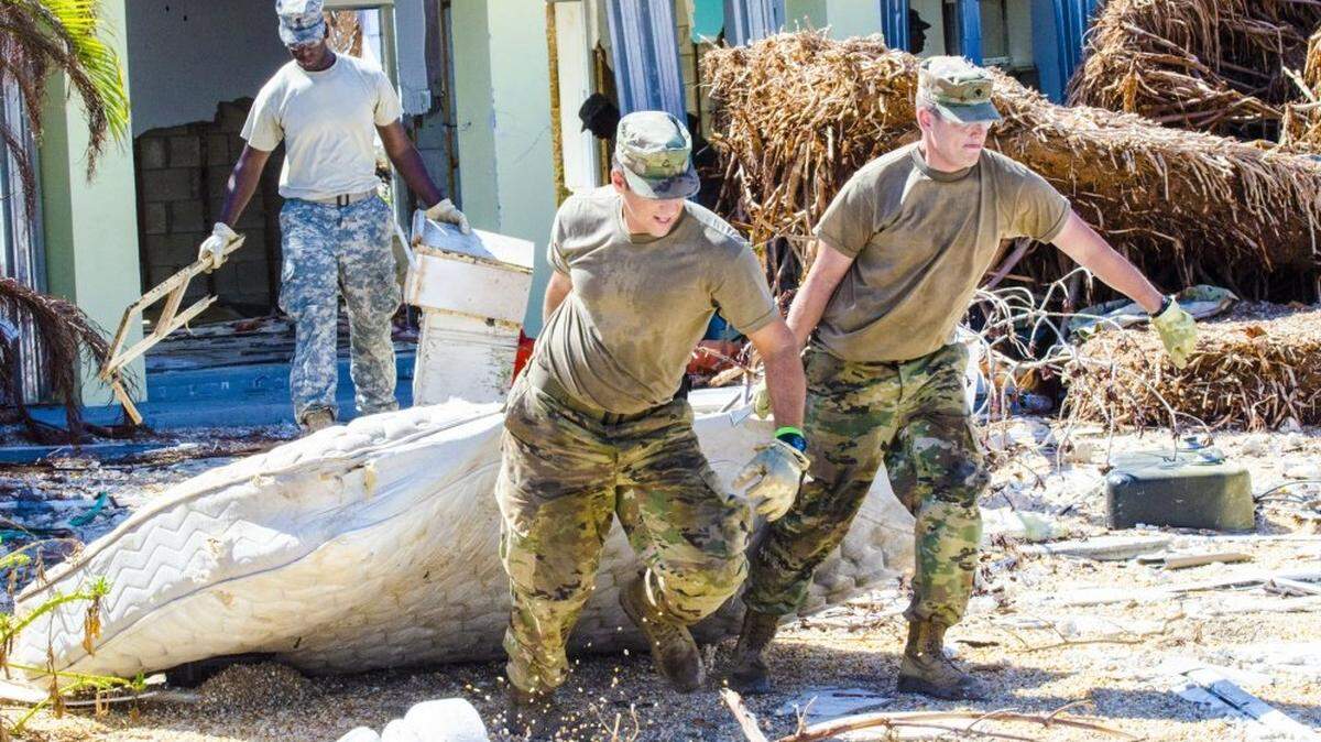 Hurricane-relief duties are one of the primary missions of the new Florida State Guard. In this photo, National Guard troops pitch in to help with cleanup on Big Pine Key after Hurricane Irma in 2017.