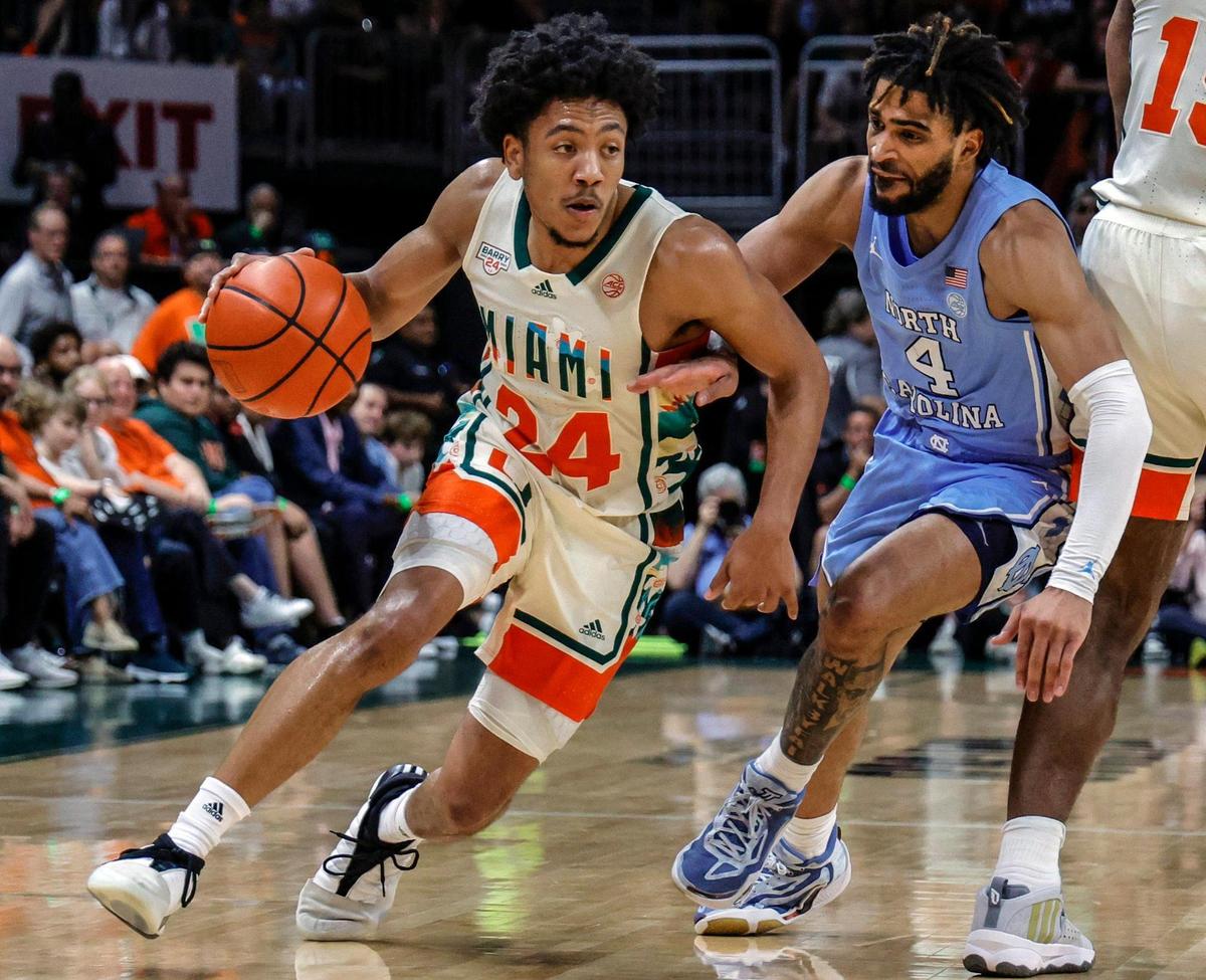 Miami Hurricanes guard Nijel Pack (24) drives to the basket as North Carolina Tar Heels guard RJ Davis (4) defends in the first half at the Watsco Center in Coral Gables, FL on Saturday, February 10, 2024.