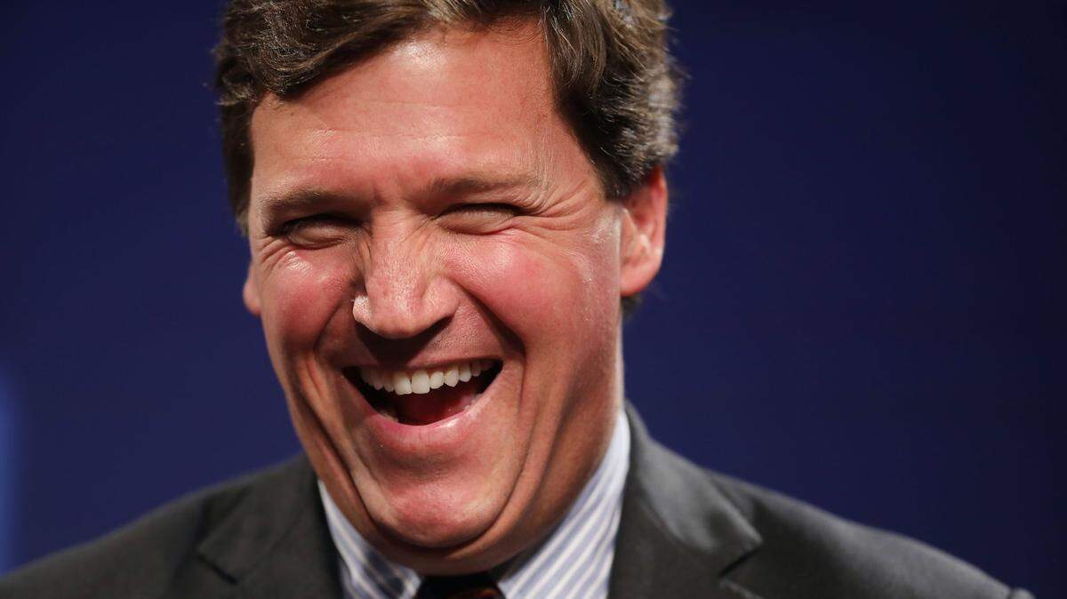 Fox News TV host Tucker Carlson says there’s not evidence that QAnon exists.