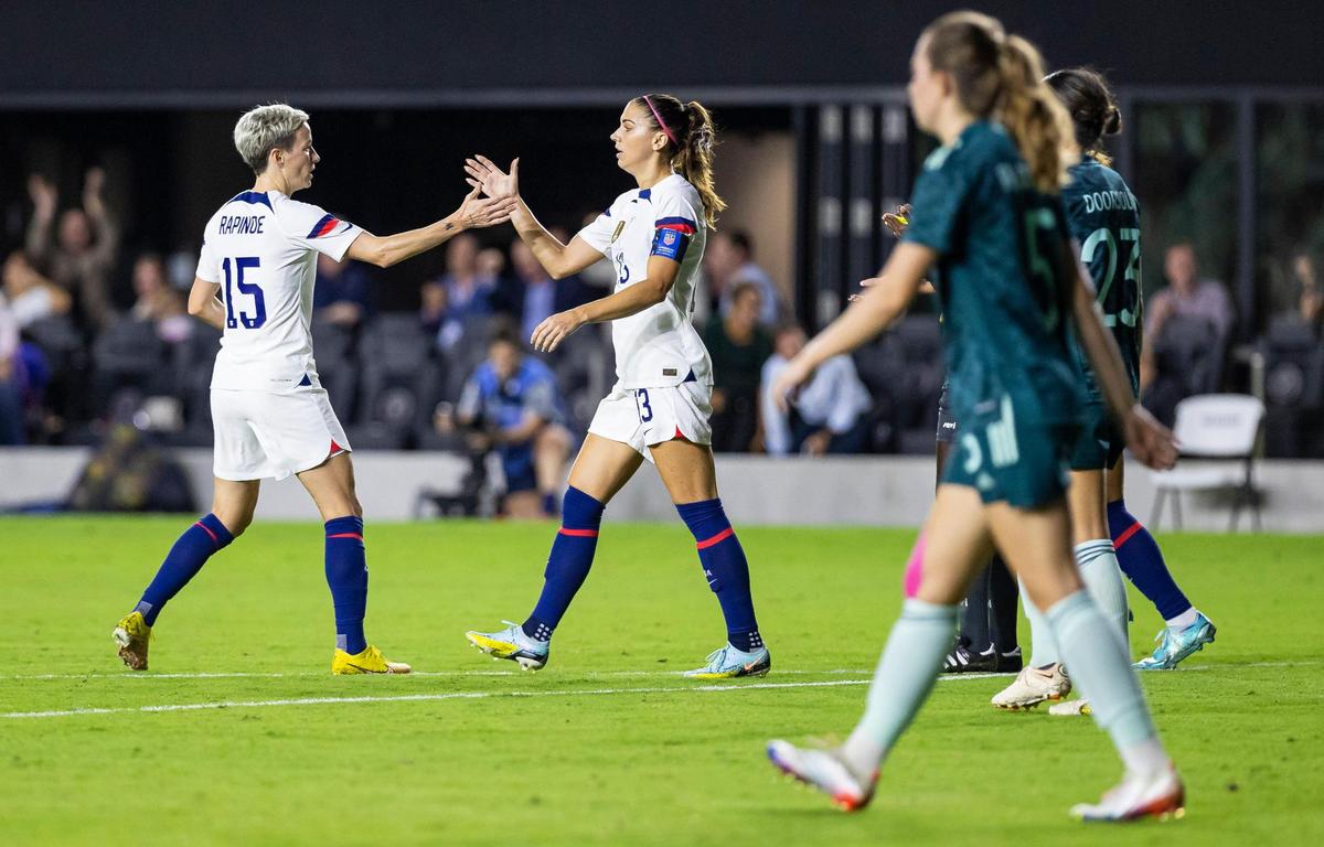 United States forwards Megan Rapinoe (15) and Alex Morgan (13) celebrate after scoring a goal against Germany during the second half of an international friendly soccer match at DRV PNK Stadium on Thursday, Nov. 10, 2022, in Fort Lauderdale, Fla.