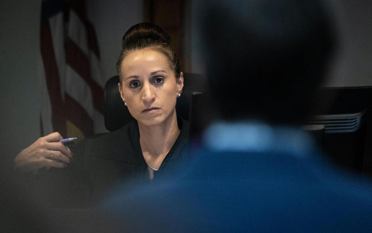 Miami-Dade Circuit Court Judge Christine Bandin on Friday listens to the attorney for suspended Miami Commissioner Alex Diaz de la Portilla, who is facing a host of public corruption charges, enter a not guilty plea for his client.