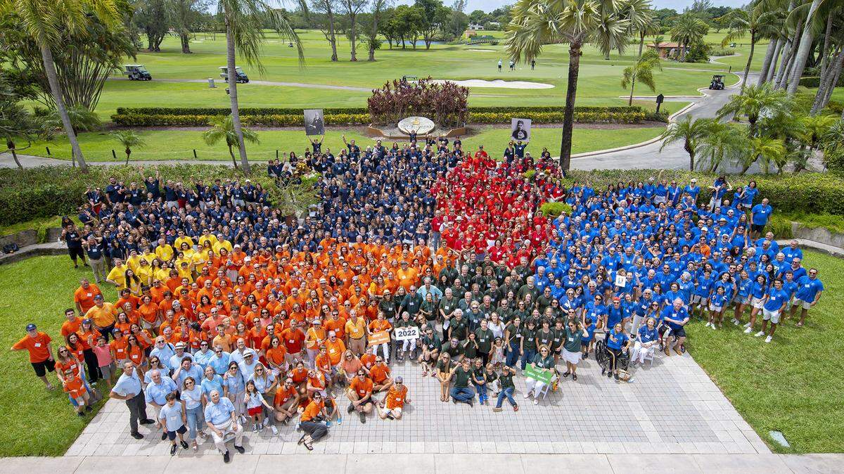 850 descendants of Don Antonio Gonzalez de Mendoza and Doña Maria de la Mercedes Pedroso pose outside The Biltmore Hotel in Coral Gables during a family reunion on Sunday, August 7, 2022. They wore specific colors to trace their lineage back to one of seven groups, which were started by Don Antonio’s and Doña Maria’s seven children who married.