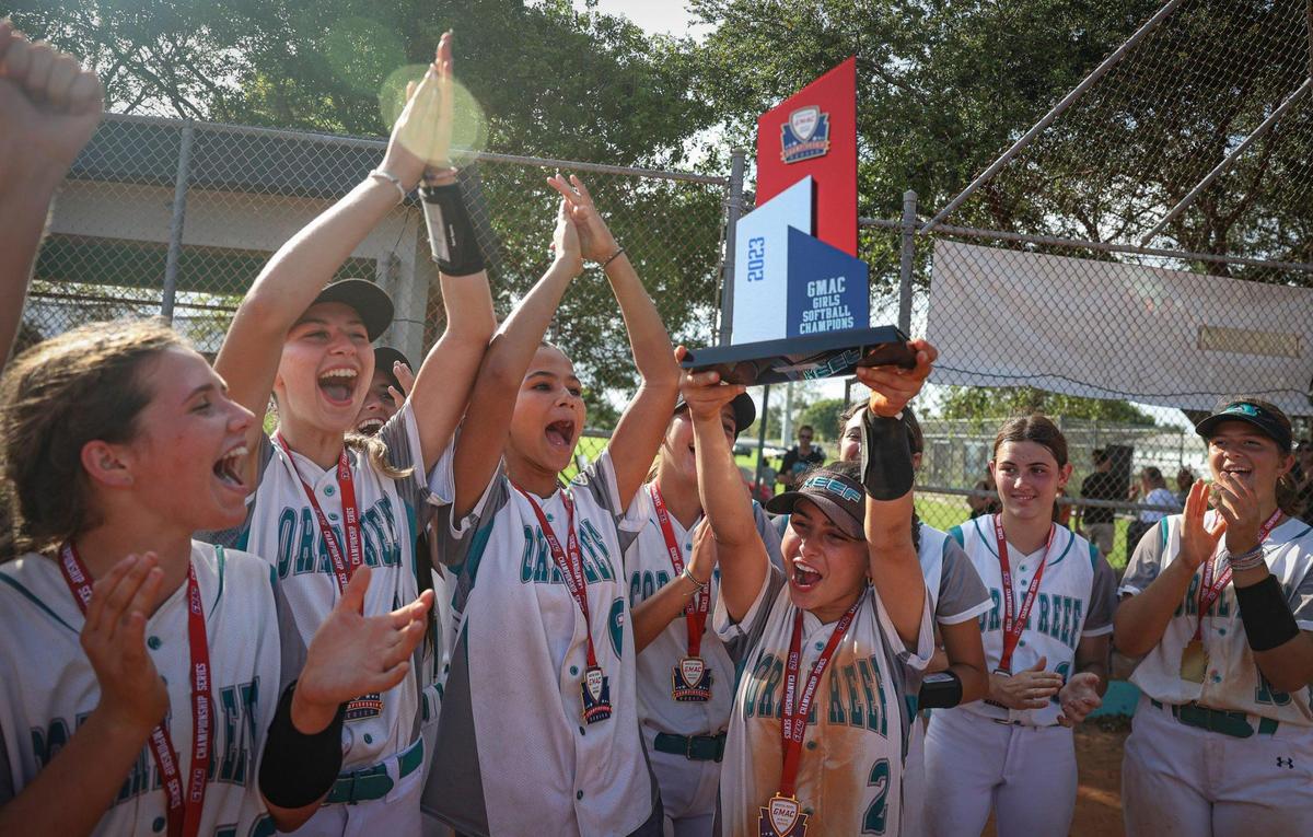 Coral Reef celebrates winning the Greater Miami Athletic Conference softball final against Palmetto on Thursday, April 20, 2023, at Coral Reef High School in Richmond Heights, Fla.