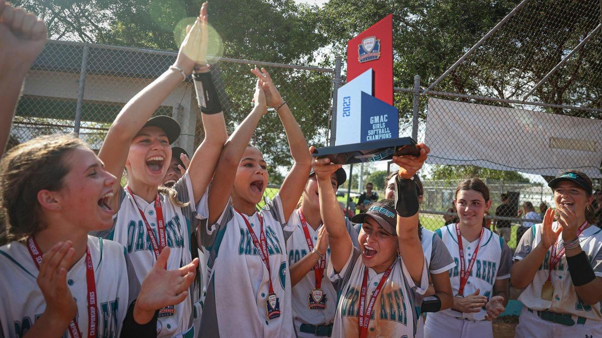 Coral Reef celebrates winning the Greater Miami Athletic Conference softball final against Palmetto on Thursday, April 20, 2023, at Coral Reef High School in Richmond Heights, Fla.