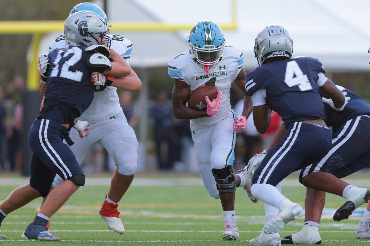 Ransom Everglades running back Noah Alce (1) carries the football against Gulliver Prep during the fourth quarter of a Region 4-2A quarterfinal football playoff game at Gulliver Prep in Pinecrest, Florida, Friday, Nov. 14, 2025.