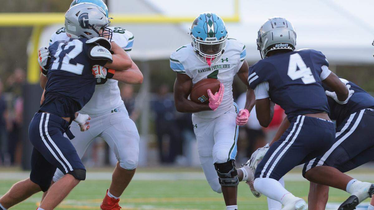 Ransom Everglades running back Noah Alce (1) carries the football against Gulliver Prep during the fourth quarter of a Region 4-2A quarterfinal football playoff game at Gulliver Prep in Pinecrest, Florida, Friday, Nov. 14, 2025.