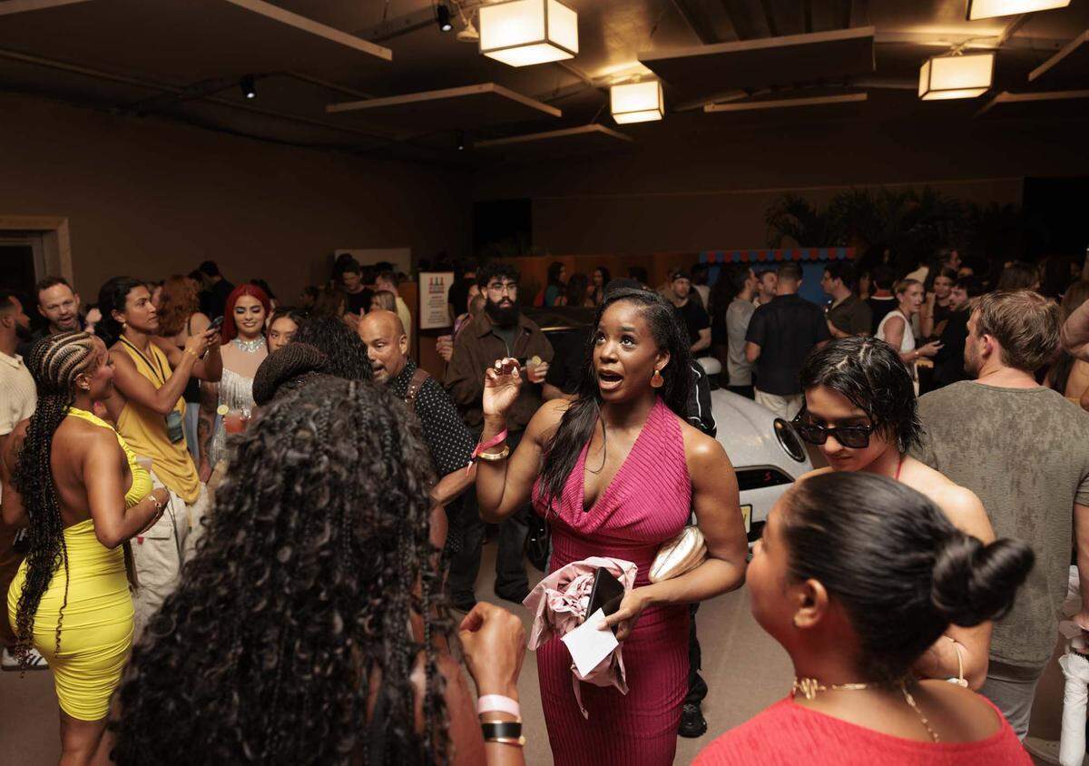 People talk in the pre-show area before the Hot Girl Summer PARAISO Miami Swim Week Runway Show on Thursday, May 28, 2026, on Collins Ave. in Miami Beach, Fla. (Miami Herald photojournalists were restricted from covering the actual runway show).