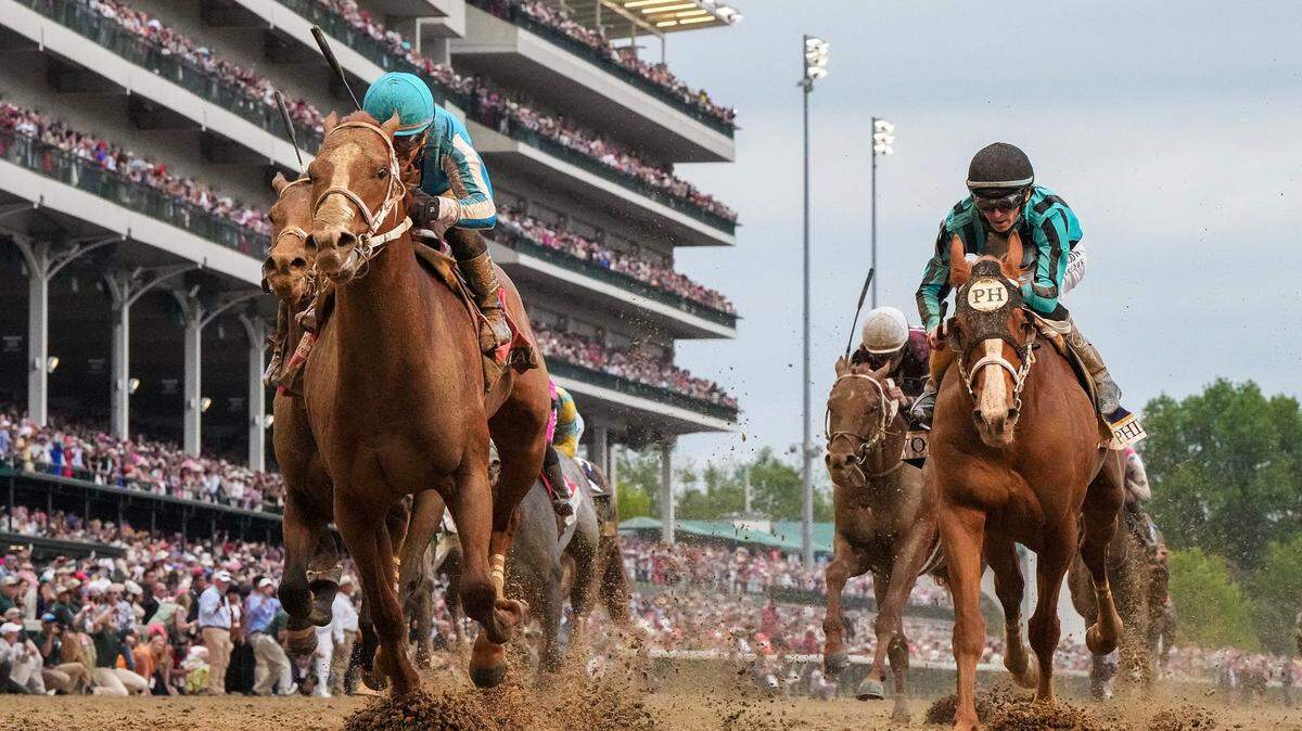 Mage, left, with Javier Castellano up, wins the 149th Running of the Kentucky Derby on May 6, 2023, at Churchill Downs.
