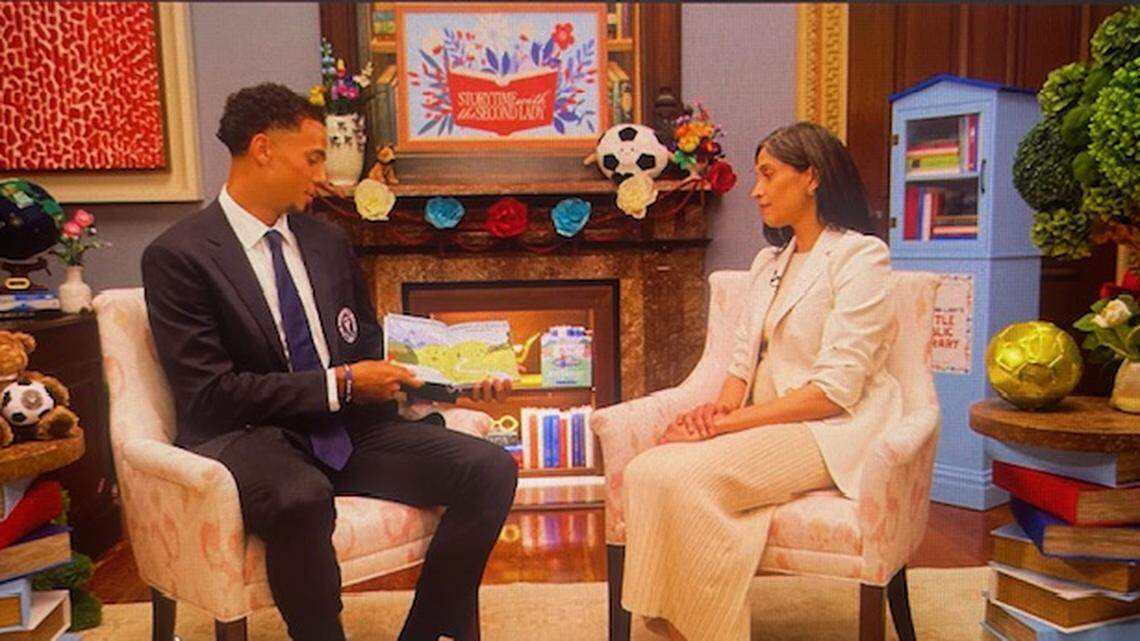 Inter Miami defender Ian Fray (left) reads the children’s book “X Marks the Spot” as a guest on the podcast of U.S. Second Lady Usha Vance (right).