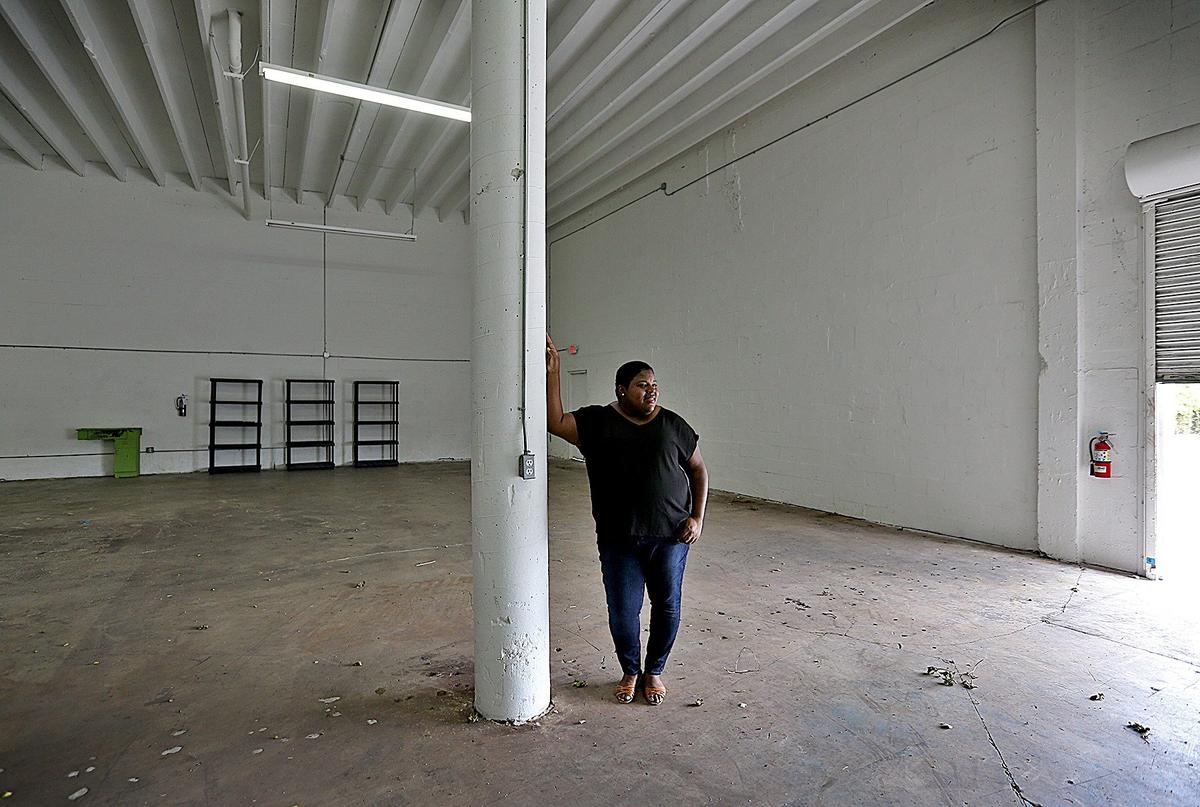 Valencia Gunder, 34, the founder of the Community Emergency Operations Center (CEOC), prepares to stock this north Miami warehouse with hurricane prep items for local poor communities.