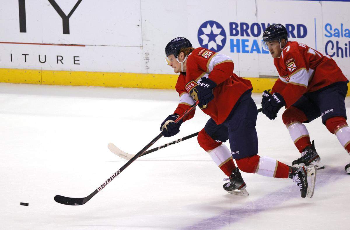 Florida Panthers right wing Owen Tippett (74) and Frank Vatrano (77) drives down the ice with the puck against the Nashville Predators during the first period of their NHL game at the BB&T Center on Thursday, March 18, 2021 in Sunrise, Fl.