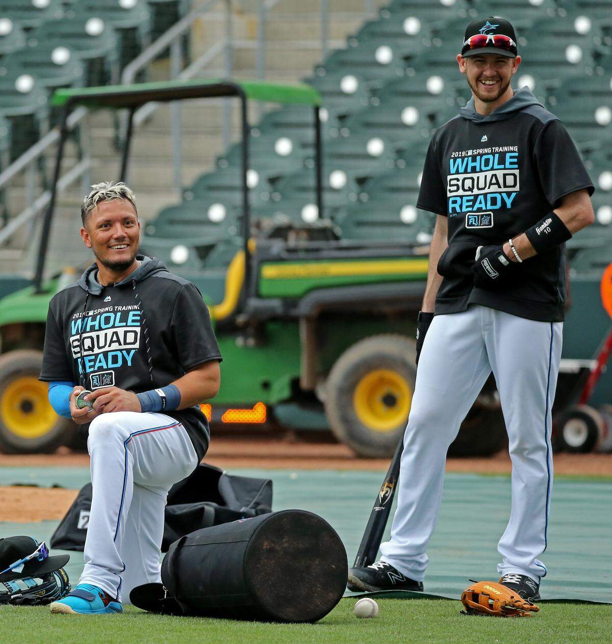 Miami Marlins infielders Miguel Rojas and JT Riddle laughing during batting practice before the start of a Major League Baseball spring training game against the Houston Astros at Roger Dean Chevrolet Stadium on Tuesday, February 26, 2019 in Jupiter, FL.